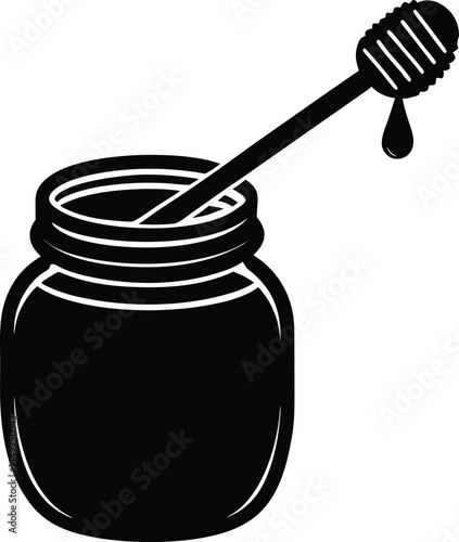 jar of honey with dipper on white background
