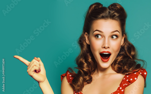 Woman surprise showing product .Beautiful pin up  girl  with curly hair  pointing to the side . Presenting your product. Isolated on white background. Expressive facial expressions