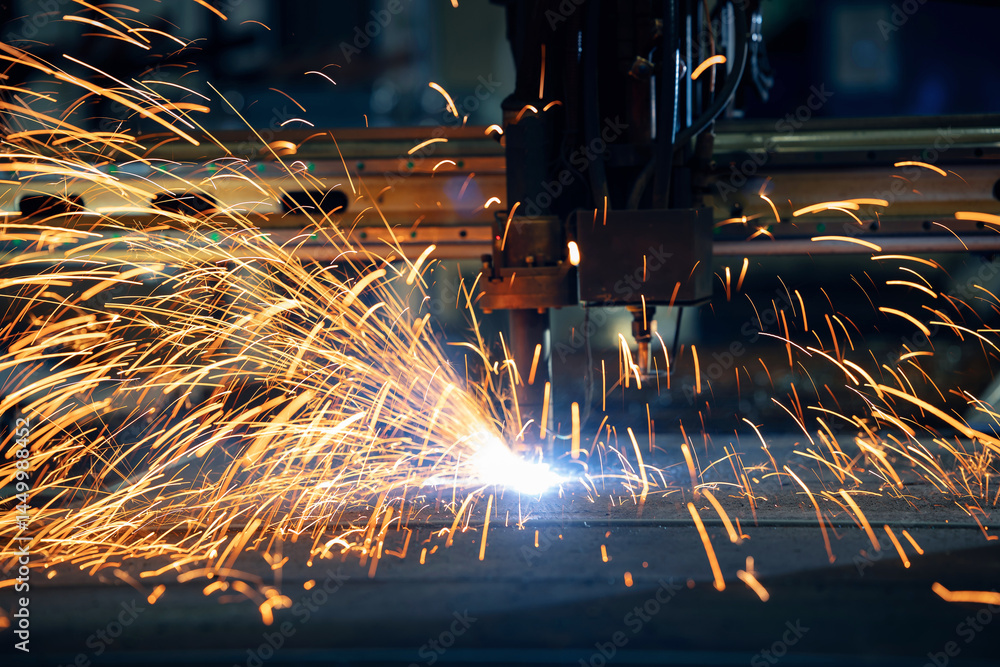Plasma cutting machine cuts metal material with sparks, industrial background Plasma cutting machine cuts metal material with sparks, industrial background