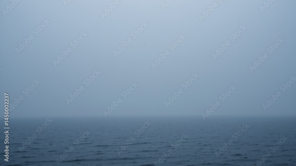 Raining sky over the Atlantic Ocean, Tenerife. Minimalism. Misty morning in the sea. Calm view. Tranquil empty landscape with soft blue gray sky. Natural gloomy weather. Raining sky over the Atlantic Ocean, Tenerife. Minimalism. Misty morning in the sea. Calm view. Tranquil empty landscape with soft blue gray sky. Natural gloomy weather.
