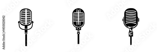 Vintage microphones lined up against a white background showcasing different designs from past decades