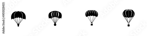 Silhouettes of parachutes descending against a clean backdrop during a clear day in an outdoor adventure setting