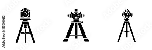 Vintage surveying equipment arranged in a line showcasing classic technology used in land measurement