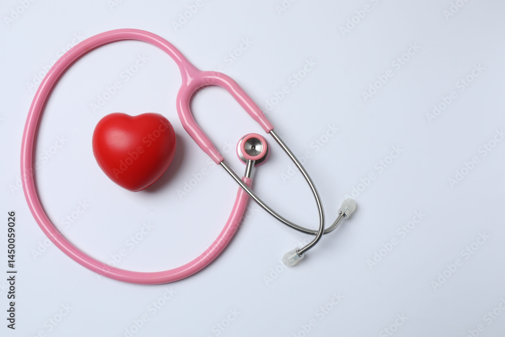 pink ribbon, stethoscope on a white background pink ribbon, stethoscope on a white background