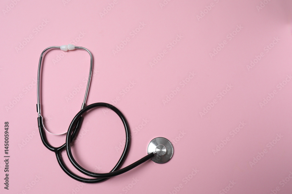 Fototapeta premium medical stethoscope on a pink background