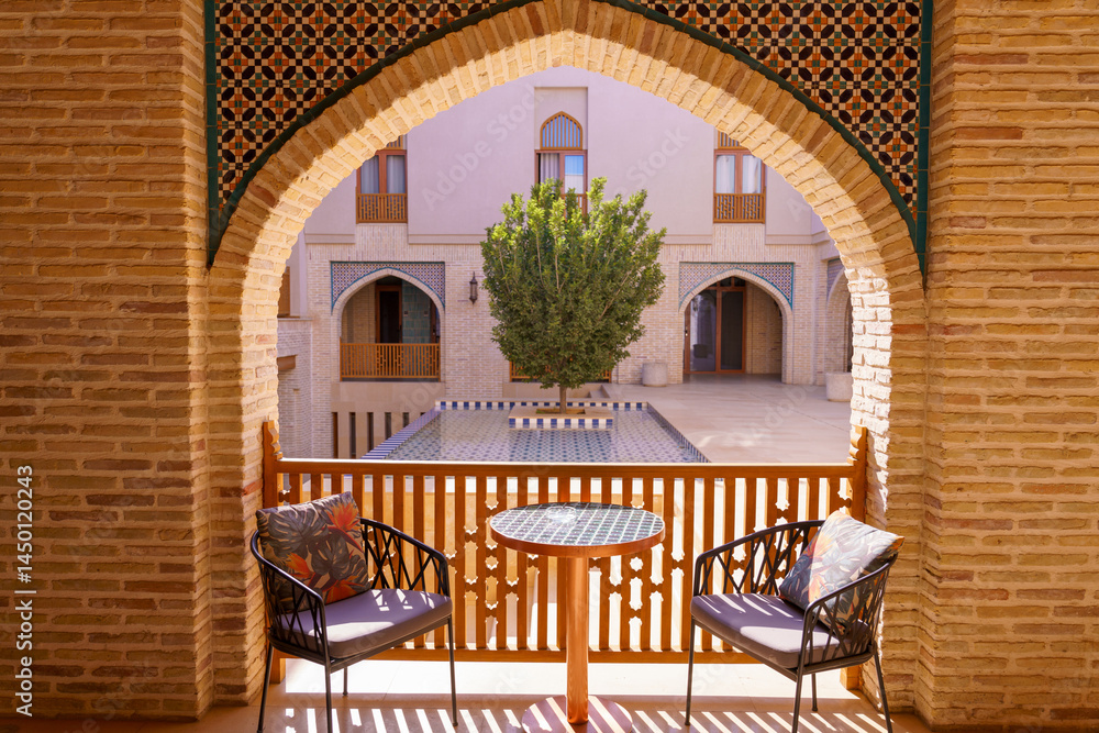 Fototapeta premium A balcony with two chairs and a table