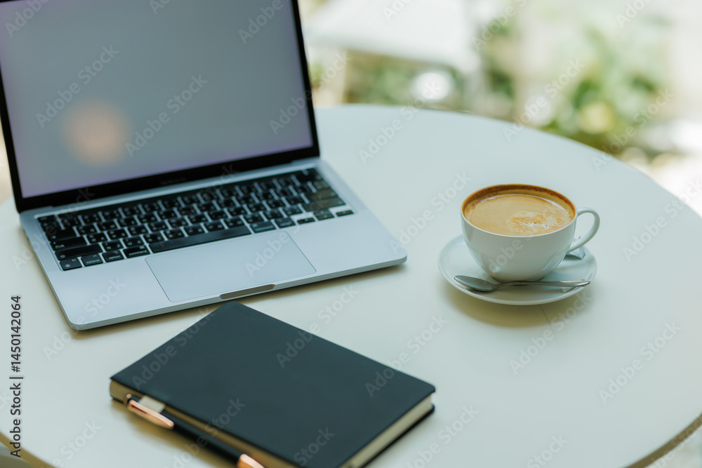 A clean white desk holds a cup of coffee, an open notebook, and a sleek minimalist laptop—ready for a calm and focused workspace. A clean white desk holds a cup of coffee, an open notebook, and a sleek minimalist laptop—ready for a calm and focused workspace.