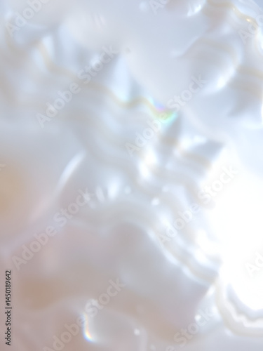 Mother of Pearl Texture: Close-up view of a mother-of-pearl surface, showcasing its iridescent and swirling patterns, with varying shades of creamy white and soft beige.