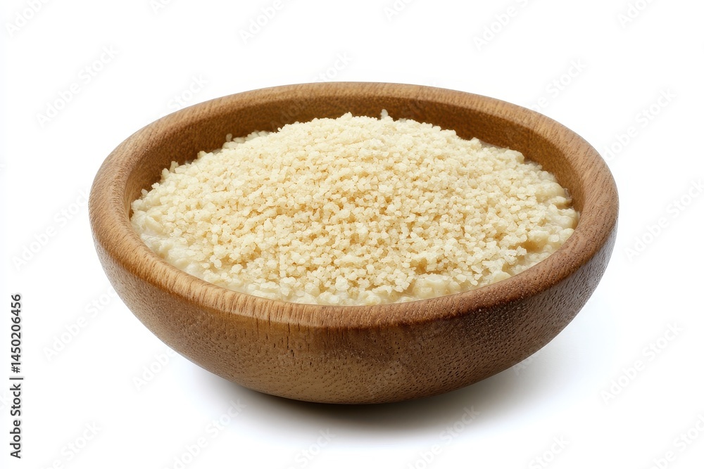 Bowl of couscous on a white background, highlighting its texture for culinary use Bowl of couscous on a white background, highlighting its texture for culinary use