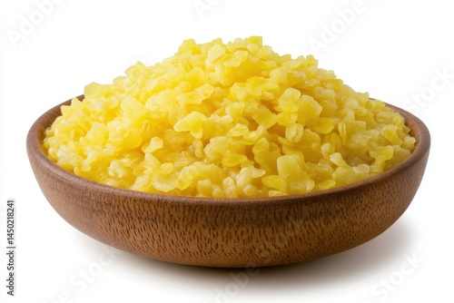 Close-up of a wooden bowl filled with bright yellow bulgur wheat on a clean background