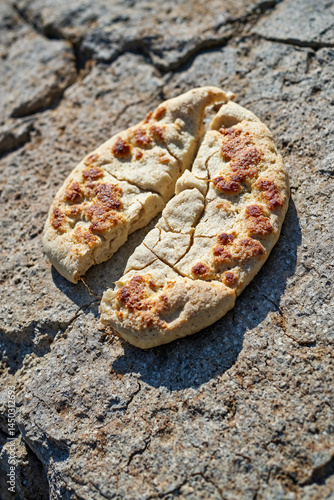 Broken Rustic Flatbread on Natural Rock Surface