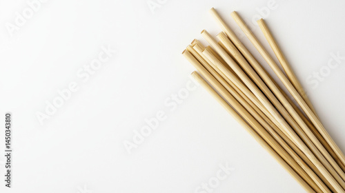 Wallpaper Mural Bamboo chopsticks arranged neatly on white background, showcasing their natural texture and color. Perfect for dining and culinary use Torontodigital.ca