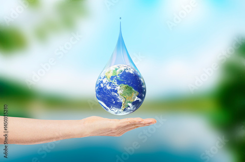 Fototapeta Naklejka Na Ścianę i Meble -  Drop Earth on man hand on blurred of lake background. Environmental protection concept. Elements of this image furnished by NASA.