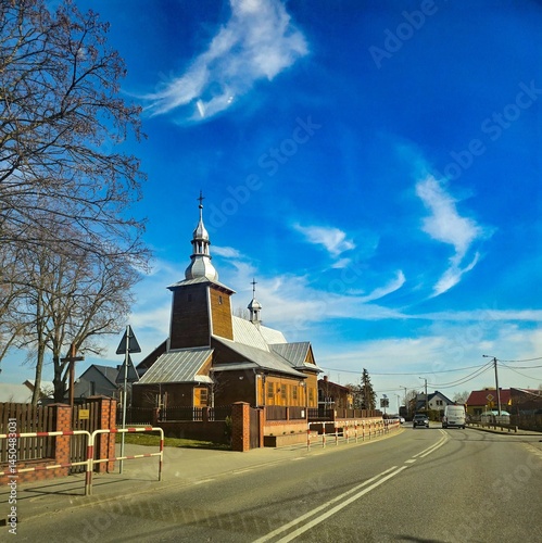Traditional Wooden Church in Rural Landscape, Rustic Slavic Architecture