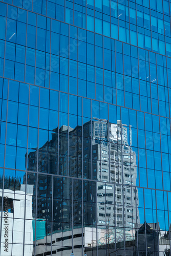 Obraz na płótnie Reflection of a Skyscraper in Windows w salonie