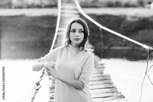 Obraz na płótnie beautiful brunette european girl in blue trench coat at nature. Young lady with beautiful face and lips. w salonie