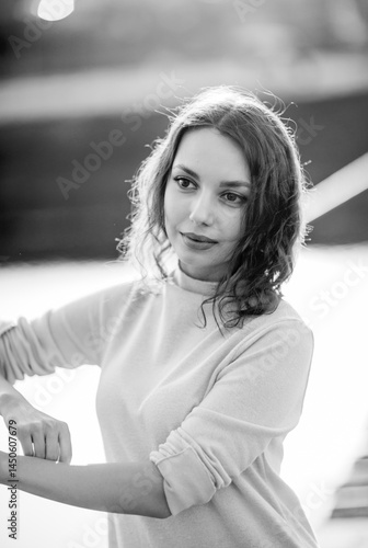 Obraz na płótnie beautiful brunette european girl in blue trench coat at nature. Young lady with beautiful face and lips. w salonie