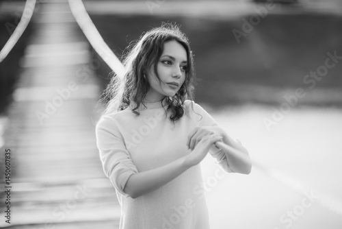 Obraz na płótnie beautiful brunette european girl in blue trench coat at nature. Young lady with beautiful face and lips. w salonie