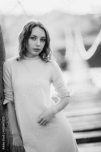 Obraz na płótnie beautiful brunette european girl in blue trench coat at nature. Young lady with beautiful face and lips. w salonie