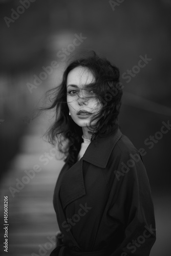 Obraz na płótnie beautiful brunette european girl in blue trench coat at nature. Young lady with beautiful face and lips. w salonie