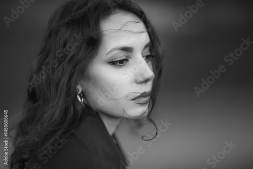Obraz na płótnie beautiful brunette european girl in blue trench coat at nature. Young lady with beautiful face and lips. w salonie