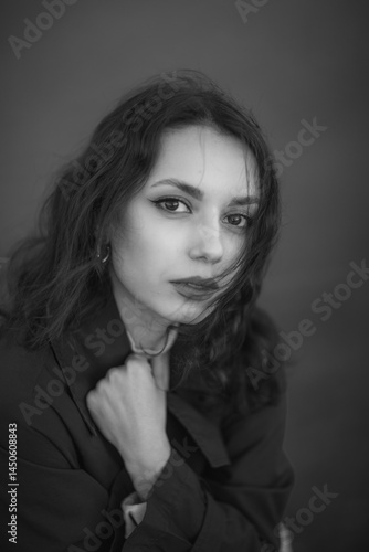 Obraz na płótnie beautiful brunette european girl in blue trench coat at nature. Young lady with beautiful face and lips. w salonie