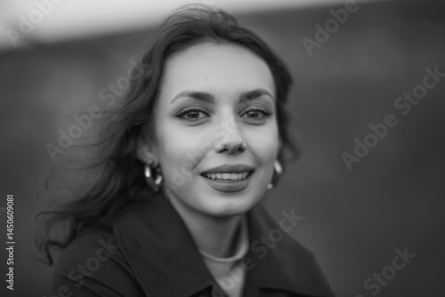 Obraz na płótnie beautiful brunette european girl in blue trench coat at nature. Young lady with beautiful face and lips. w salonie