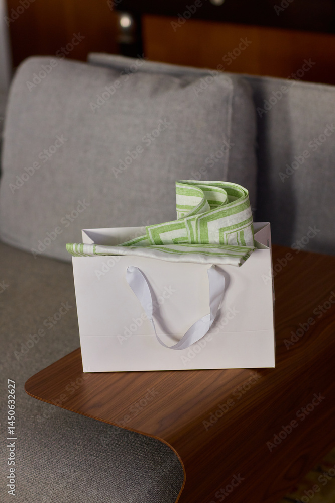 An Elegant Gift Box beautifully adorned with a Green Design and complemented by White Handles