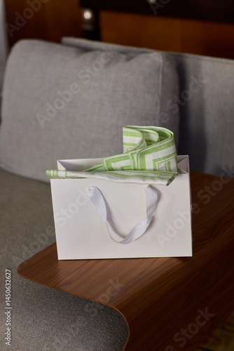 An Elegant Gift Box beautifully adorned with a Green Design and complemented by White Handles