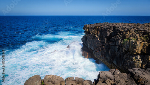 waves crashing on rocks