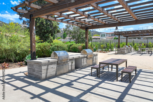 Covered gathering area in community park with picnic tables, Escondido, San Diego, California