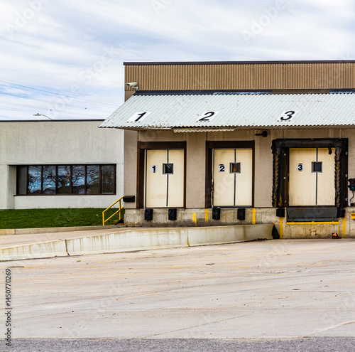 Industrial Loading Dock With Numbered Bays and Corrugated Roof Cover