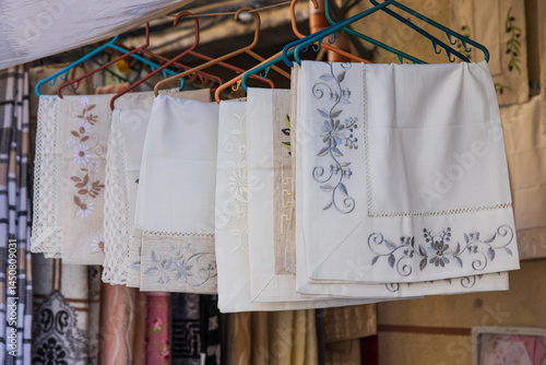 Obraz na płótnie Embroidered table cloths for sale at an outdoor market. w salonie