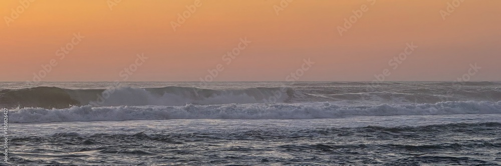 Whispering waves dance under the syrupy apricot sky, echoing Solstice serenity and coastal mindfulness retreats Whispering waves dance under the syrupy apricot sky, echoing Solstice serenity and coastal mindfulness retreats