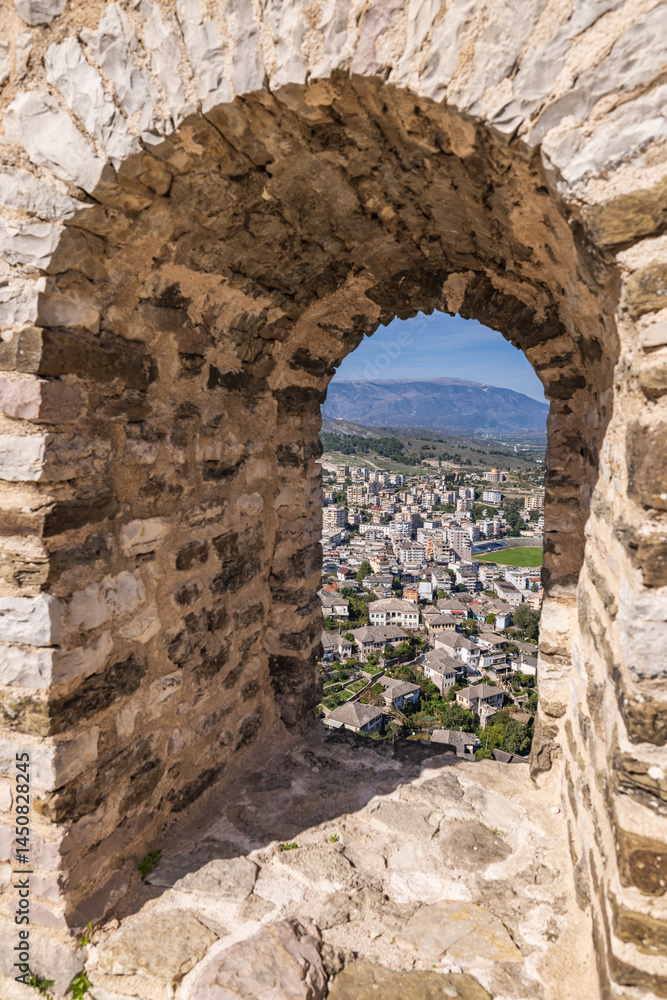 Arched window through the wall of the ruins of Gjirokaster Castle. Arched window through the wall of the ruins of Gjirokaster Castle.