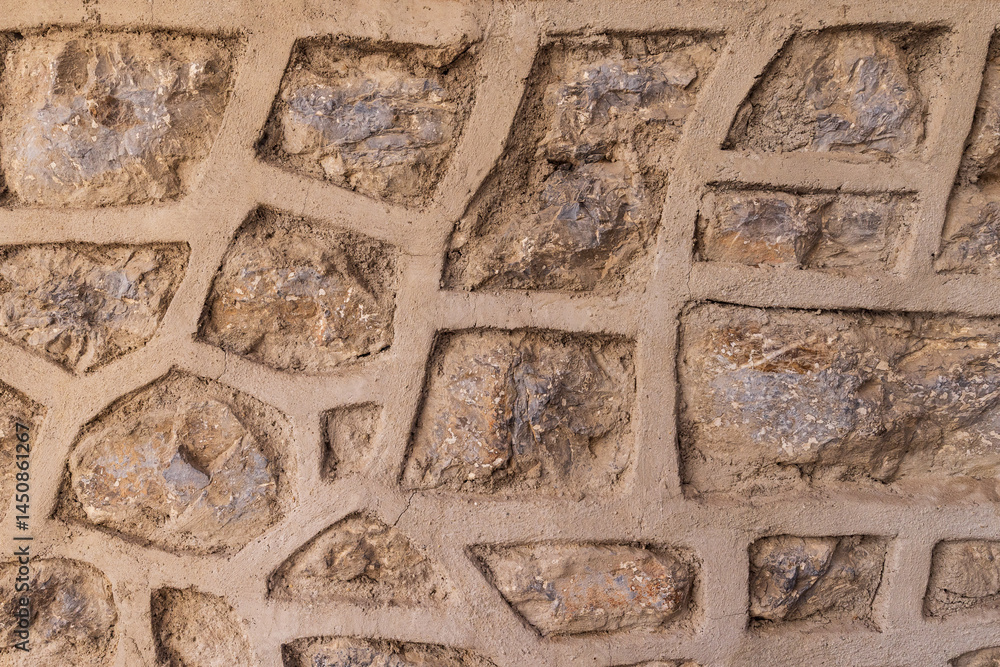 Patterns in a stone masonry wall.