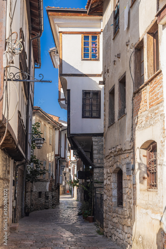 Narrow alley and traditional buildings in Ohrid.