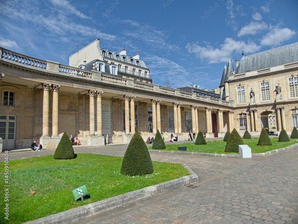 Fototapeta premium Paris, March 2025 : Visit of the magnificent city of Paris, Capital of France - View on different facades of buildings built by Baron Haussmann