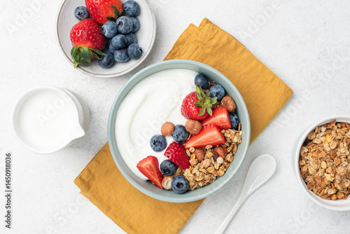 Greek yogurt bowl with crunchy granola and berries