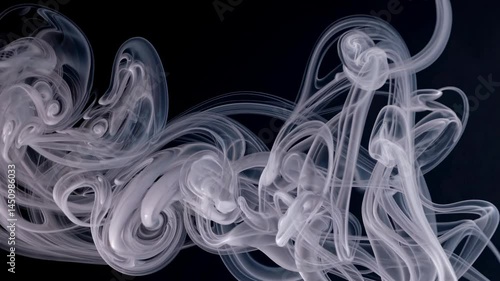 Slow Motion Wispy Smoke Swirling Gracefully on Deep Black Background