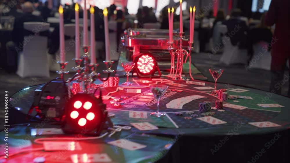 Casino themed table with cards, chips and food - steady cam shot