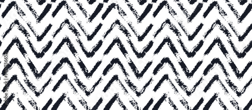 Abstract textured black and white brush stroke striped zigzag seamless pattern. Grunge brushstroke angle ornament for chevron textile design, banner, cover, wrapping paper, herringbone surface design