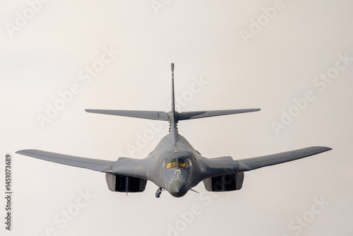 Very close frontal view of a a B-1 Lancer  flying with wings in full sweep