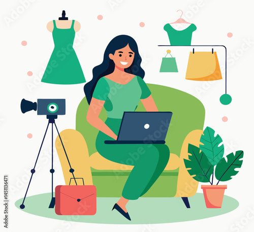Smiling darkhaired woman uses laptop sitting near mannequin, clothing rack, camera, and plant
