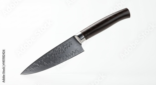 Wallpaper Mural Isolated studio shot of a chef knife with patterned blade and dark handle Torontodigital.ca