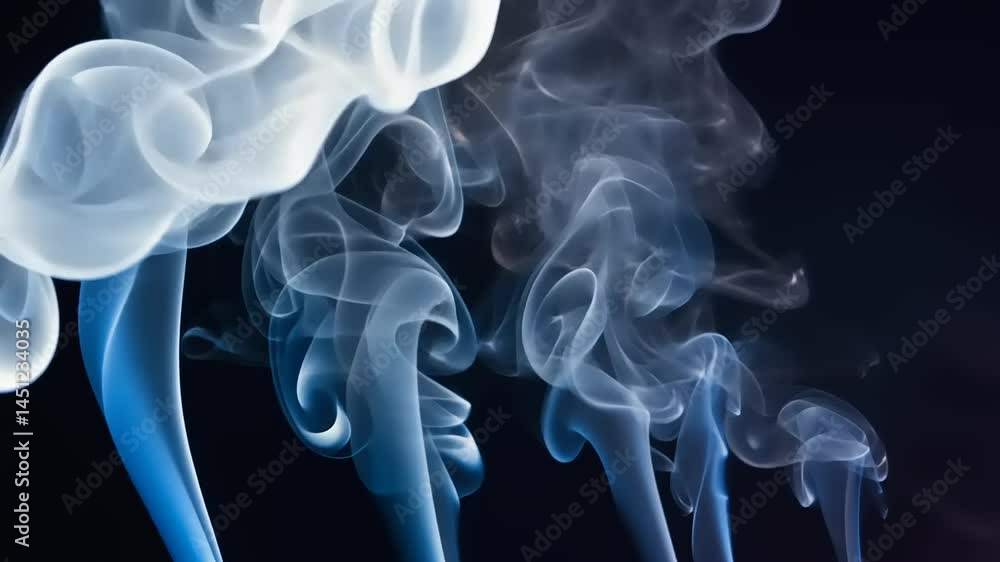Ethereal Swirls of Smoke Dancing Against a Dark Background Ethereal Swirls of Smoke Dancing Against a Dark Background