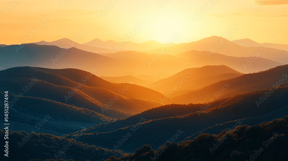 Fototapeta premium Layered mountain silhouettes fading into the distance with warm golden hour light 