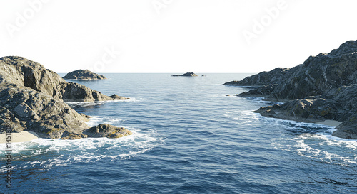 Ocean waves crashing on rocky coast at sunrise creating white foam