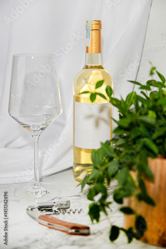 Bottle of white wine, glass on white background and pot of plant. Wine bottle openers. Wine bottle mockup.