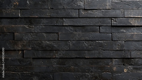 Dark gray stone wall, close-up view of a modern design.